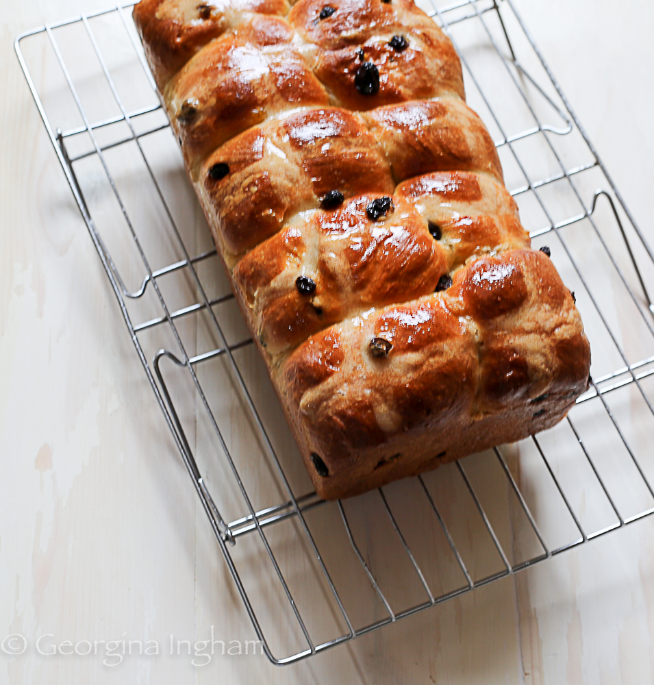 Cornish saffron loaf cooling on a rack &ndash; traditional British saffron fruit bread